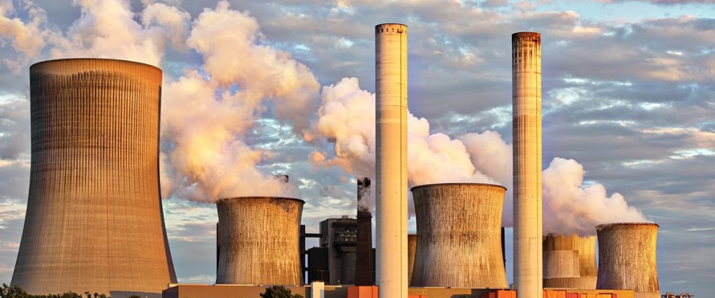 Picture of a power station with pollution coming out of the chimney