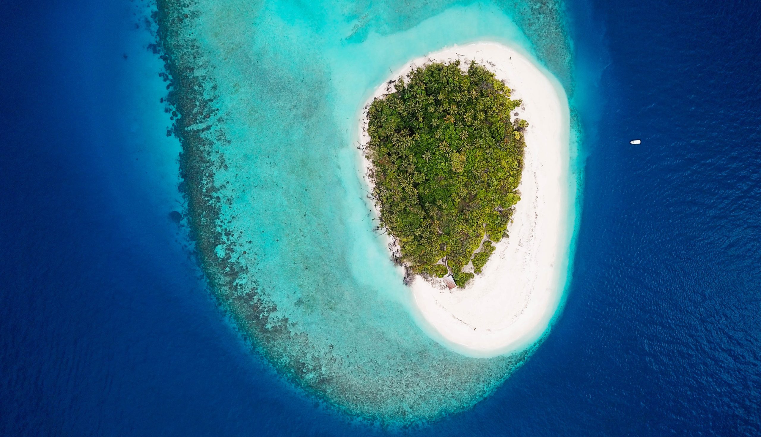 A picture of an island partially flooded by sea level rise